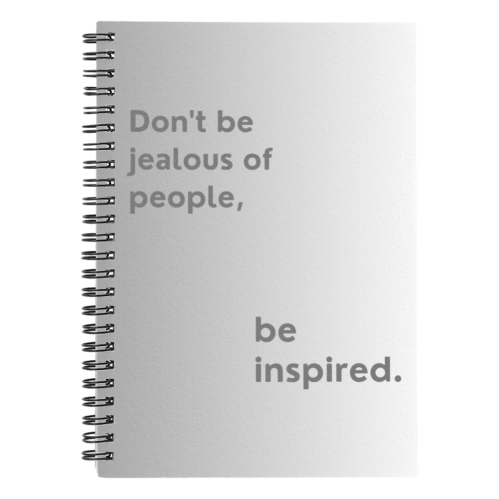 Motivational spiral notebook with quote “Don’t Be Jealous of People, Be Inspired” on printed cover.