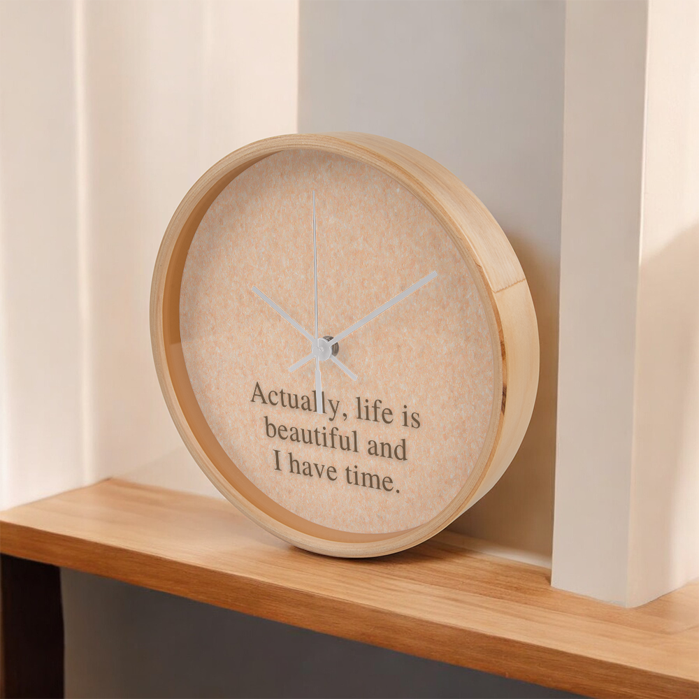 Flat lay of “Life Is Beautiful” quote clock with accessories