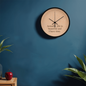 Side view of wooden wall clock with minimalist hands and smooth finish