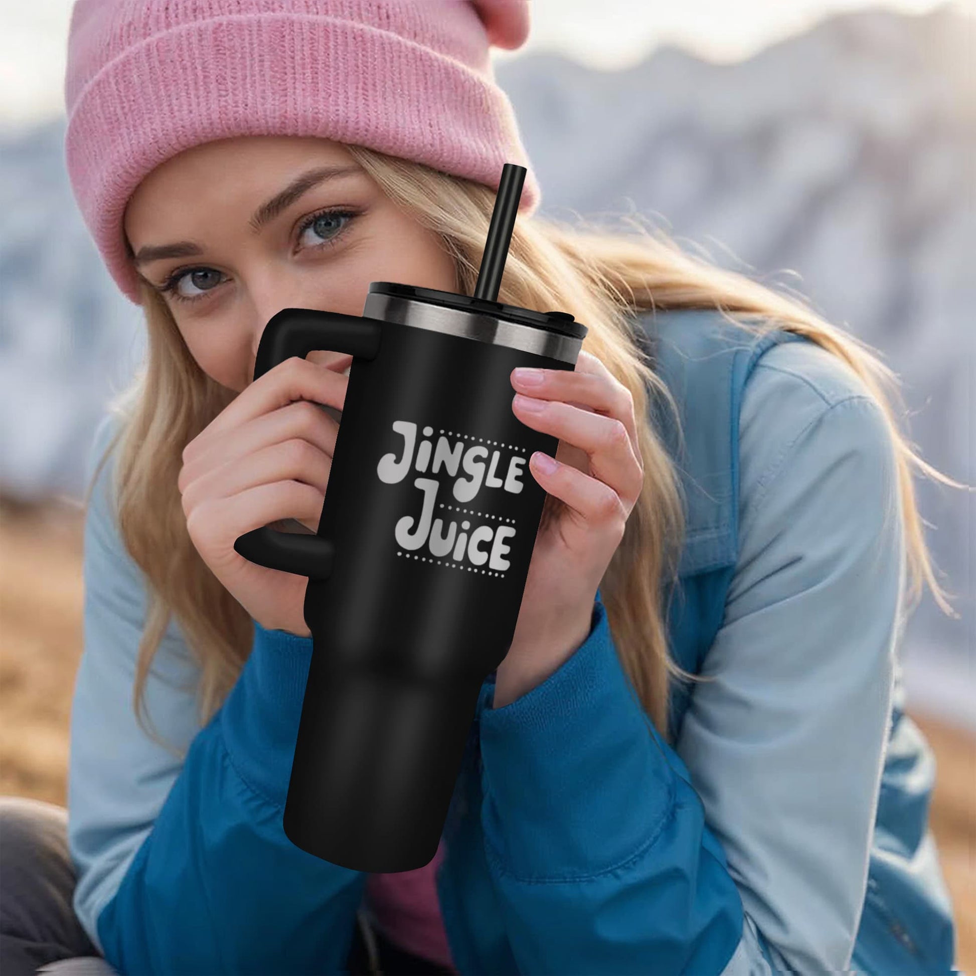 Woman holding Jingle Juice Christmas tumbler during holiday outing”