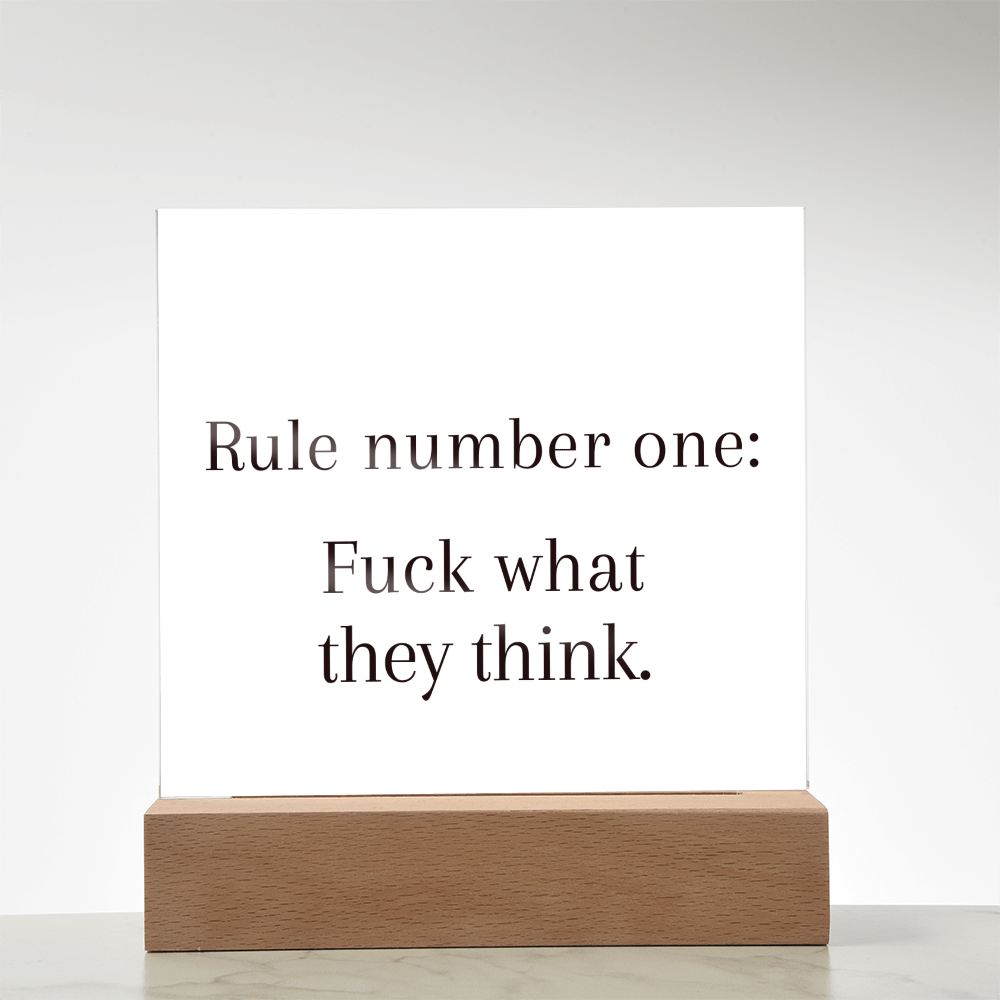 Motivational acrylic plaque glowing in rainbow LED light, symbolizing bold confidence and self-trust.