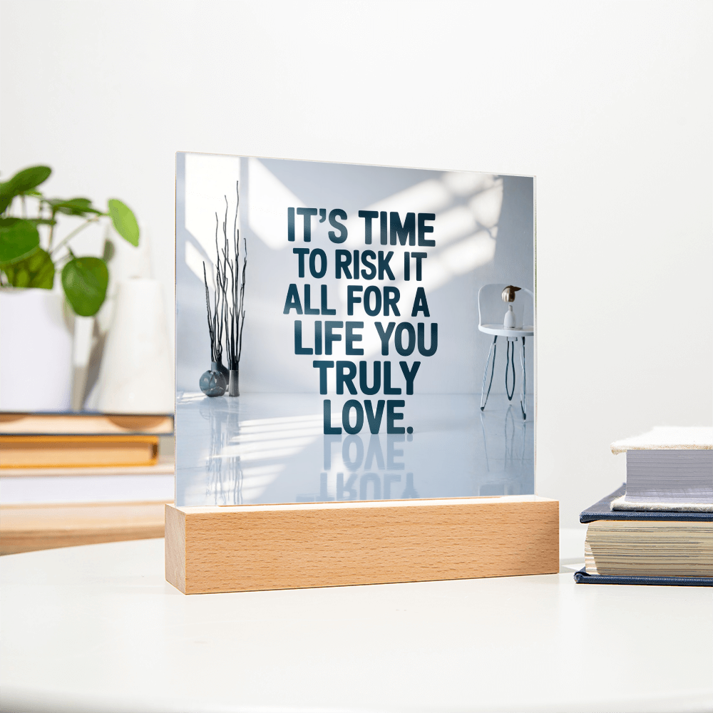 Inspirational LED quote plaque glowing in pink and blue hues on modern shelf.