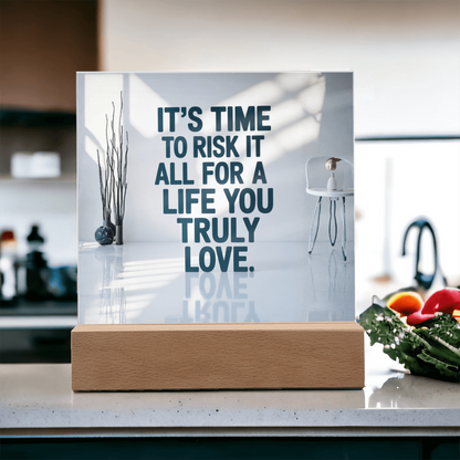 “Risk It All for a Life You Truly Love” plaque styled on bedside table with candles and journal.