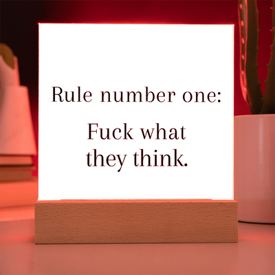 LED plaque glowing in low light, creating empowering atmosphere.