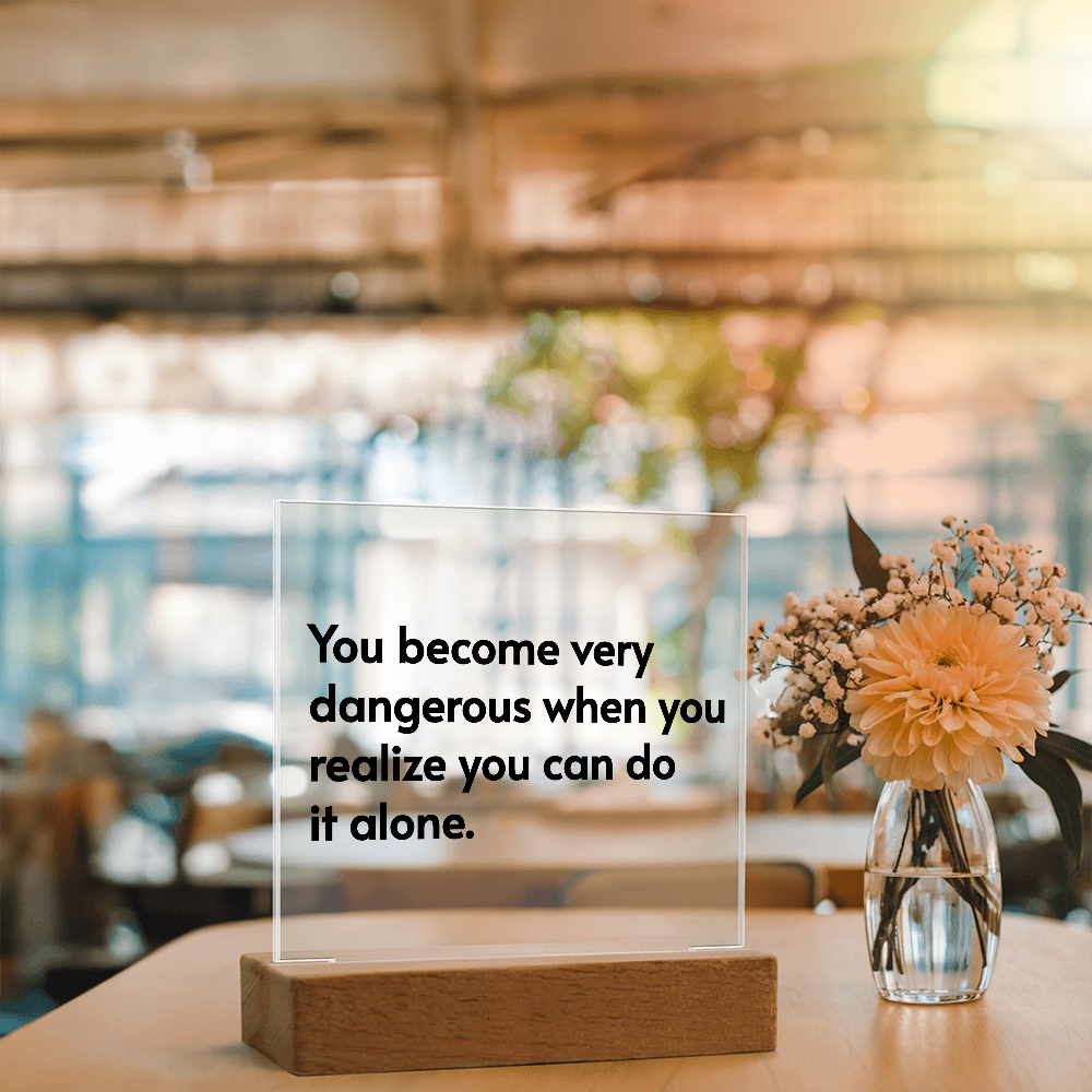 Uplifting quote illuminated on clear acrylic plaque with rainbow LED colors