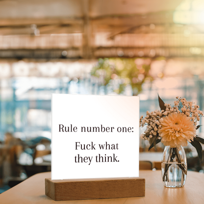Wooden LED base close-up showing USB cord and on/off controls.