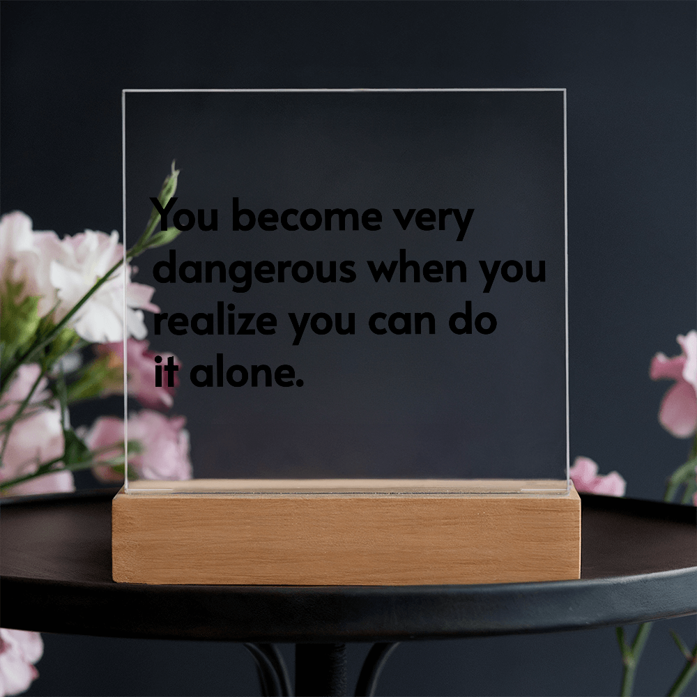 Gift-ready LED plaque with emotional message displayed beside flowers and candles