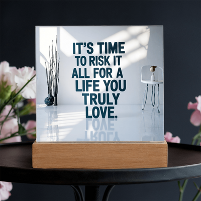 Side angle of motivational plaque showing clear acrylic depth and glowing wooden base.