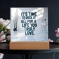 Side angle of motivational plaque showing clear acrylic depth and glowing wooden base.