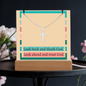 Stainless steel cross pendant on snake chain beside acrylic display