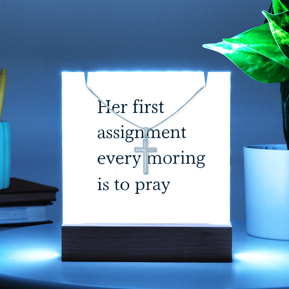 Elegant cross necklace styled on neutral background for display