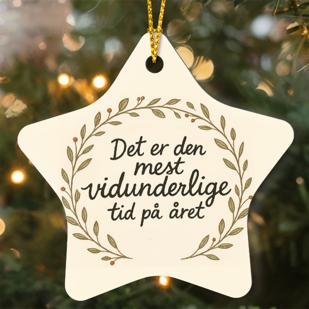 High gloss star ornament featuring Danish Christmas phrase