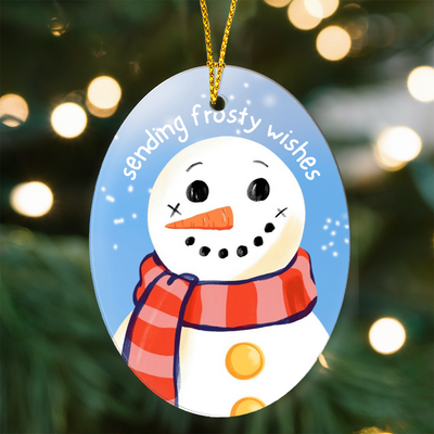 Glossy oval ornament with winter snowman design