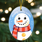 Glossy oval ornament with winter snowman design