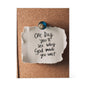 Christian quote block displayed on desk with candlelight