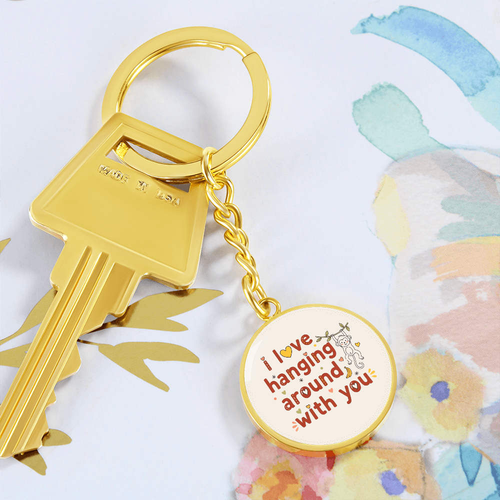 Round monkey keychain held in hand