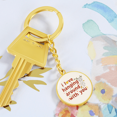 Round monkey keychain held in hand