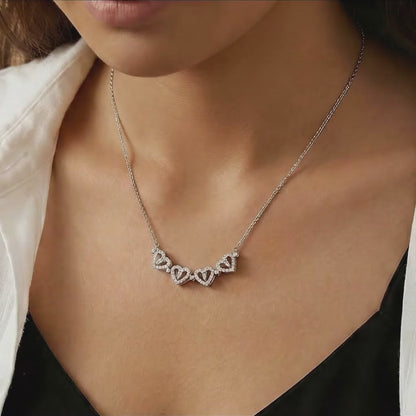 mother wearing sentimental four heart necklace